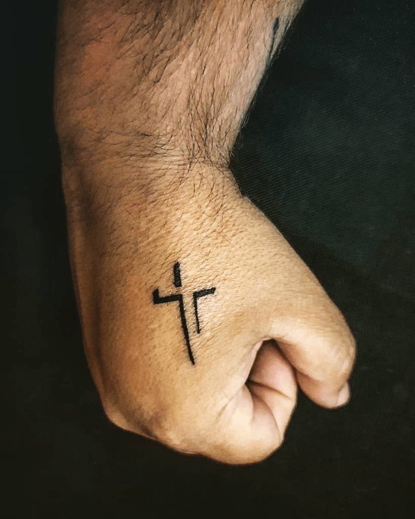 cross tattoo on hand