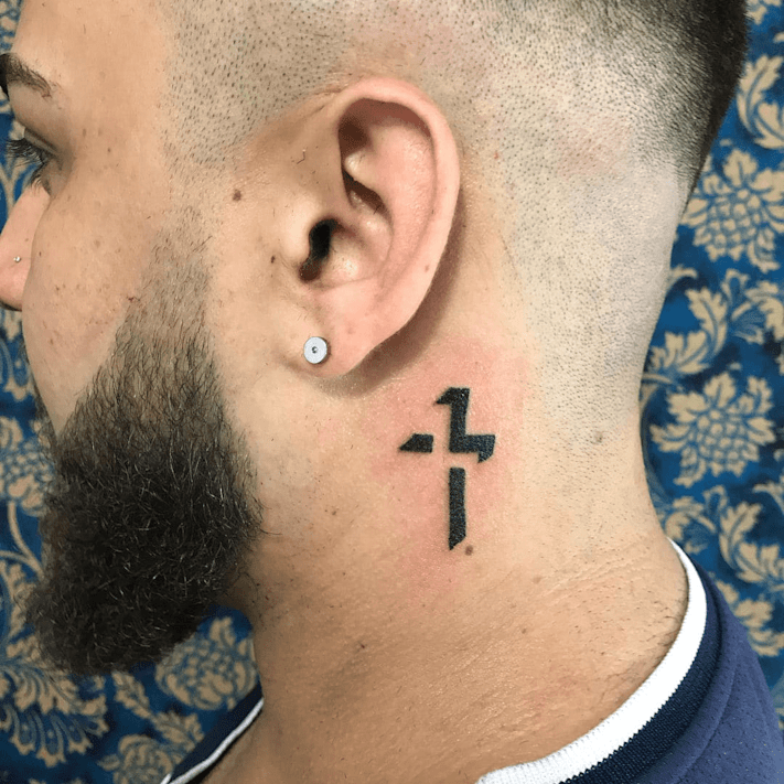 cross tattoo on the neck