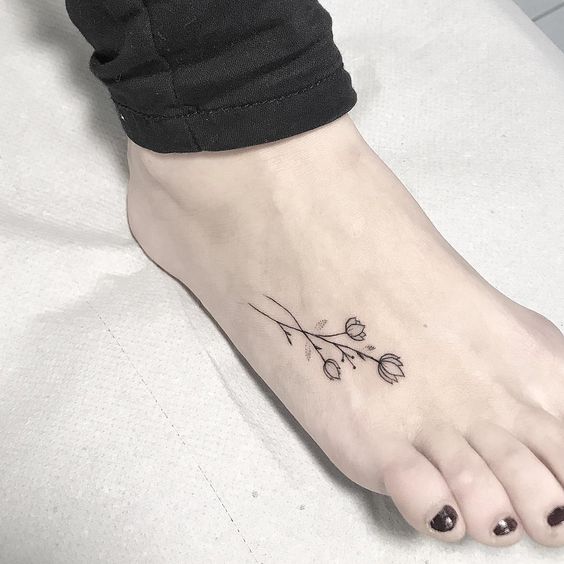 Girly foot tattoo