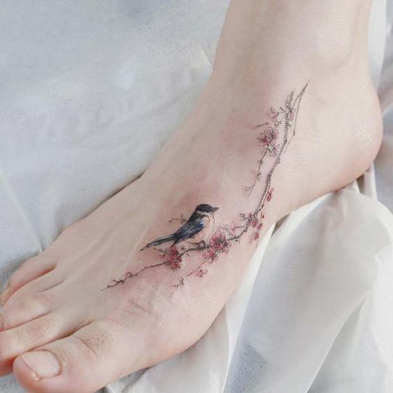 Girly foot tattoo