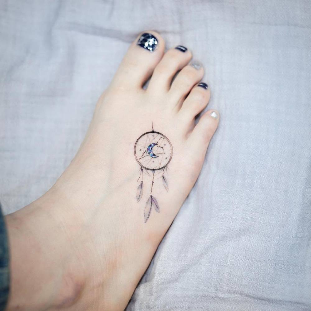 Girly foot tattoo