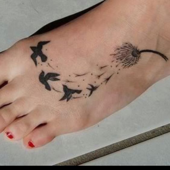 Girly foot tattoo