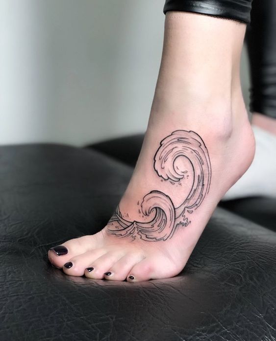 Girly foot tattoo