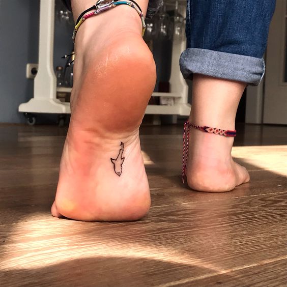 Girly foot tattoo