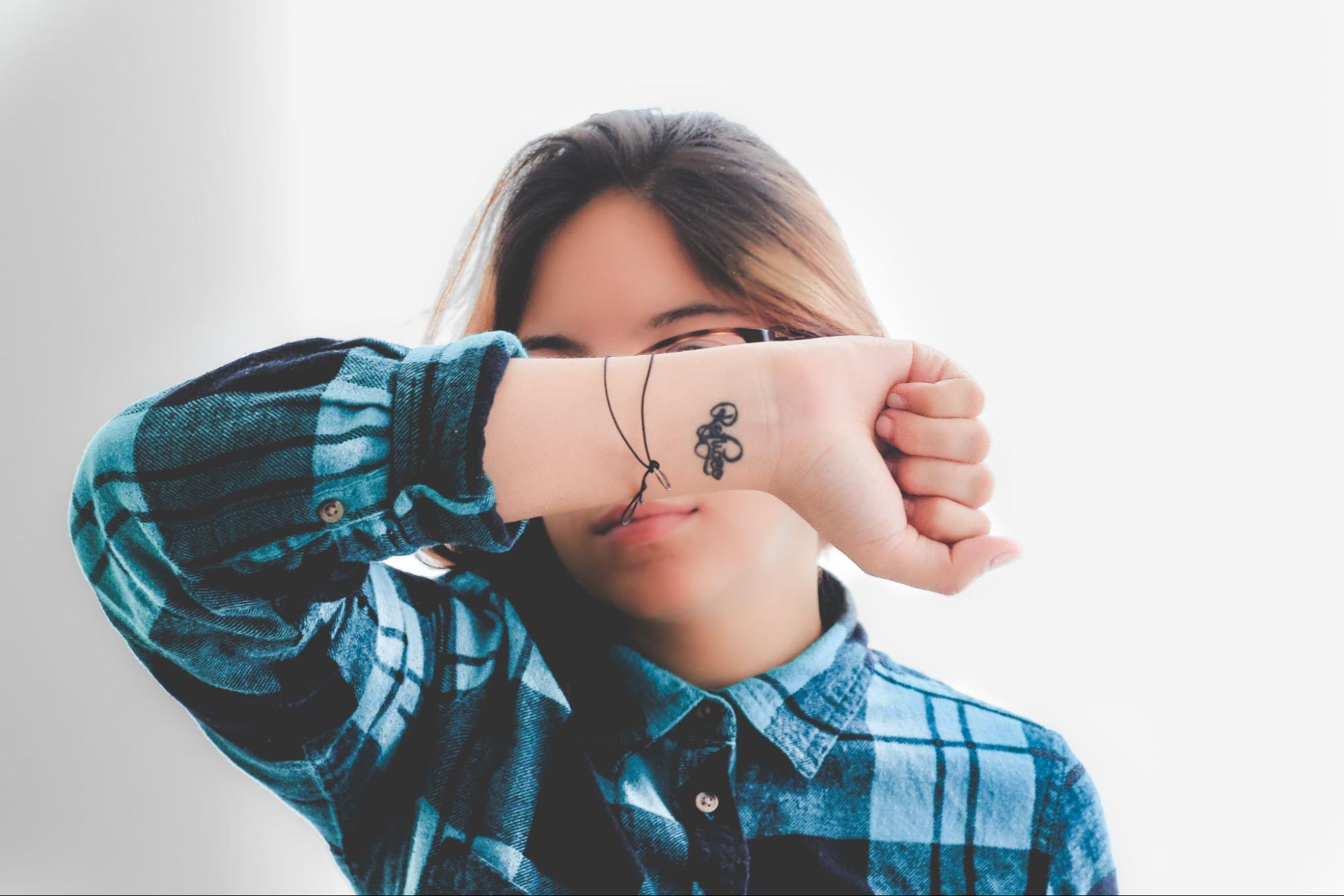 Girl with tattoo on the hand