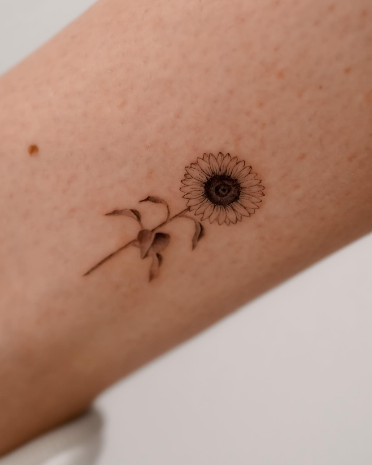 meaningful sunflower tattoo