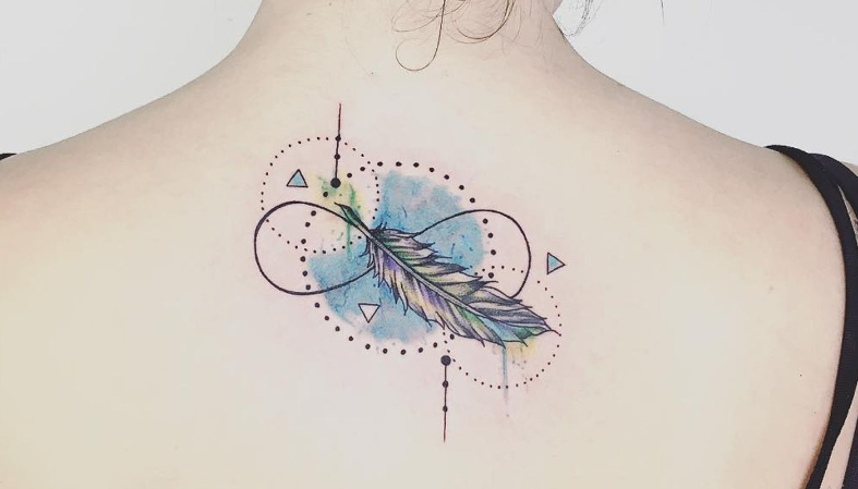 The feather tattoo on the back accompanied by blue elements