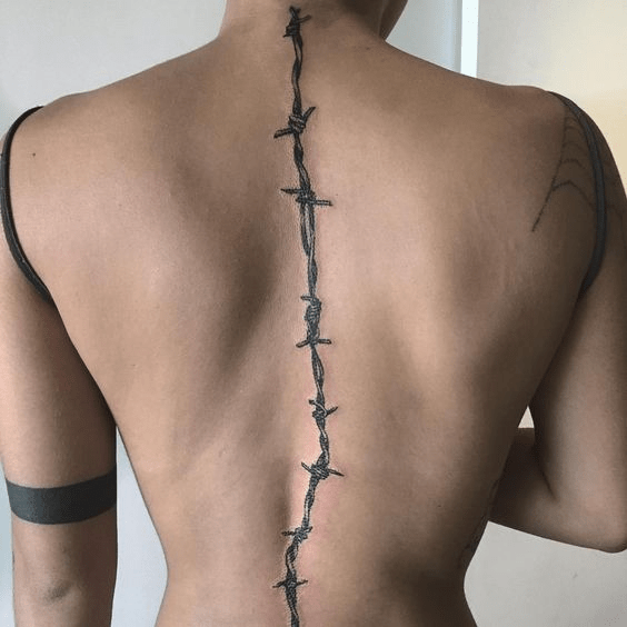 Barbed wire tattoo inked on a spine