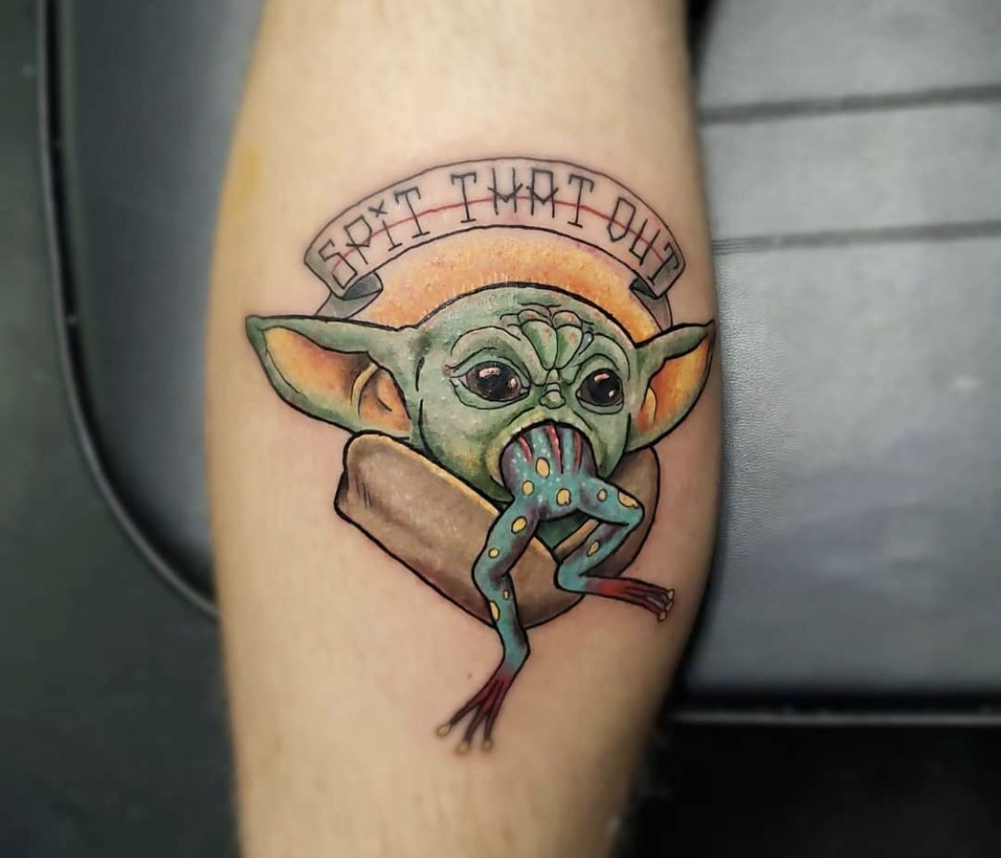 Baby Yoda with other elements This design is perfect for those who want a tattoo that represents the character in a more unique way. You can choose to include elements such as the Millennium Falcon, lightsabers, or other stuff from the series.