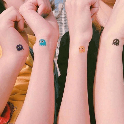 Cartoony friend tattoos