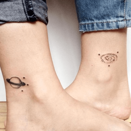 Space-inspired best friend tattoos