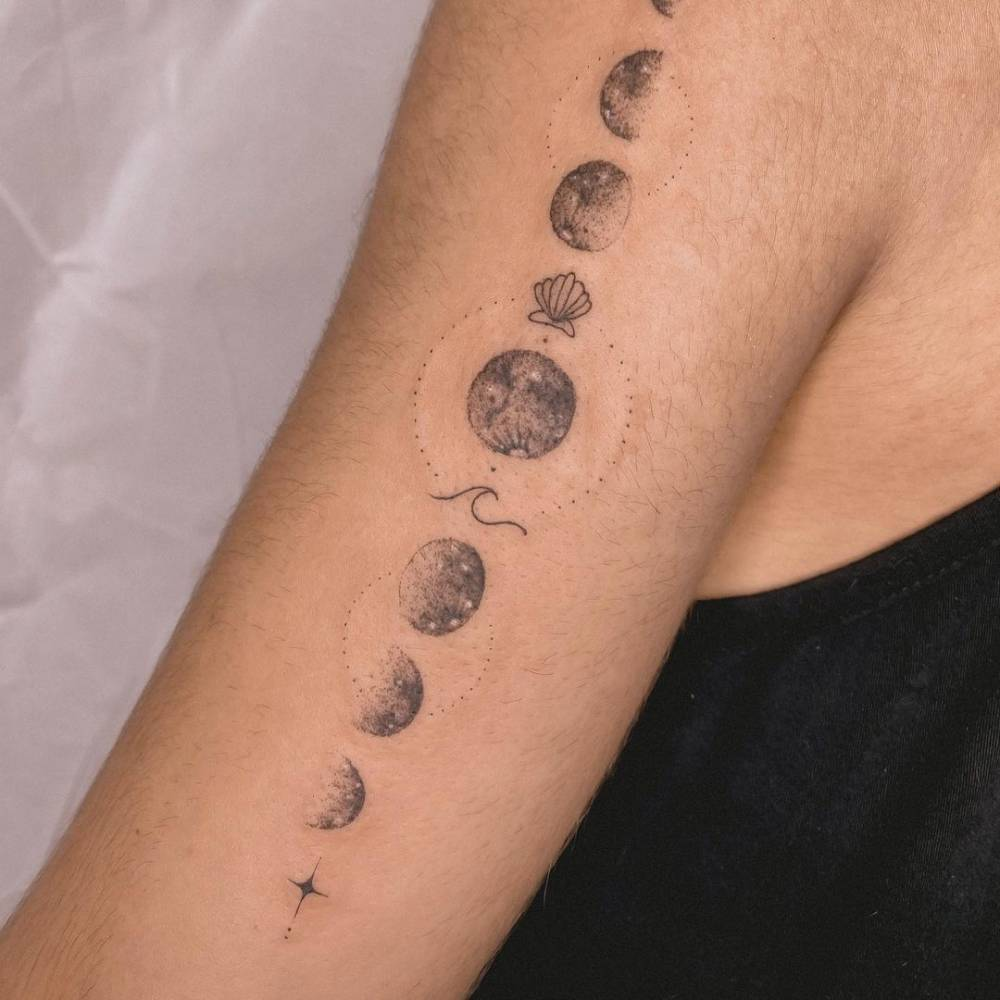 Arm moon tattoo