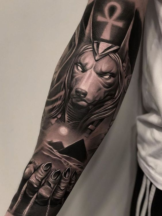 Tattoo of Anubis with pyramids 