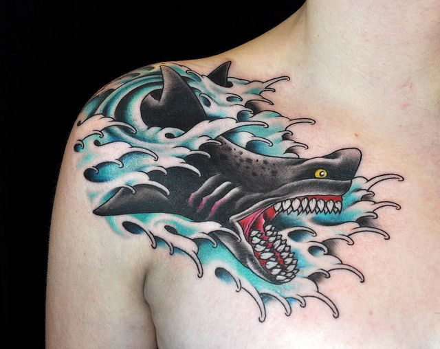 Tattoo of a shark with sea waves