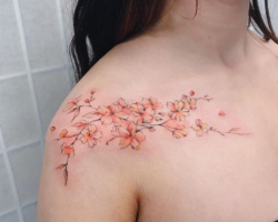 Tattoo from our artist Ali feminine cherry blossom tattoo