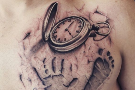 child's hand with birth clock