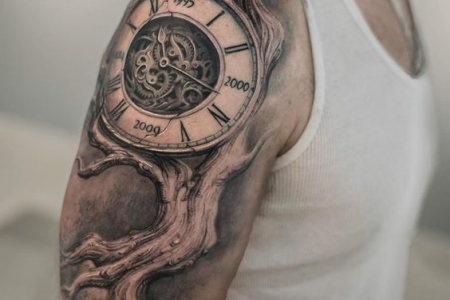 Chest clock birth tattoo