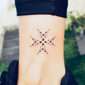 Maltese cross tattoo