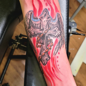 Modern cross tattoo