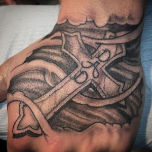 Modern cross tattoo