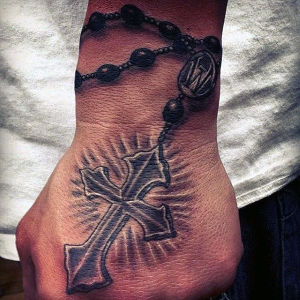 Modern cross tattoo