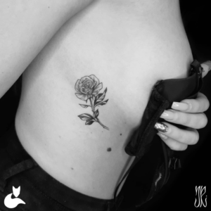 Tiny rose tattoo