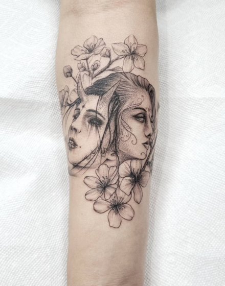 Two faces tattoo