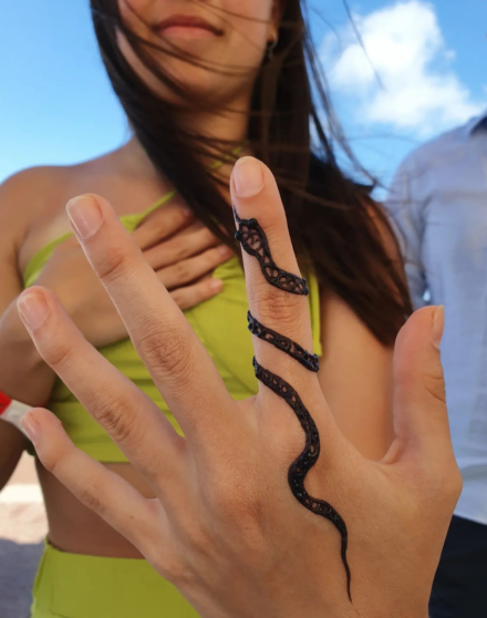 tattoo_of_cross on a finger