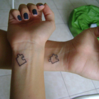 Small matching couple tattoo