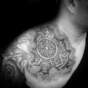 Image of a man with a chest tattoo featuring an Aztec design
