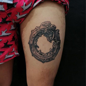 Aztec tattoos on legs