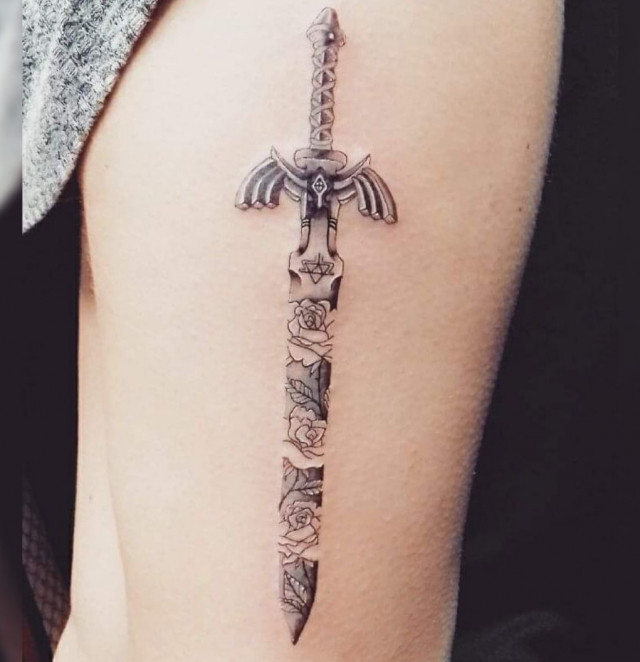 Sword with triangle tattoo design