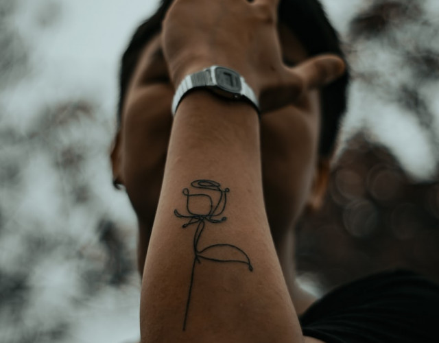 Outline rose tattoo