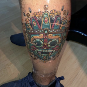 Aztec tattoos on legs