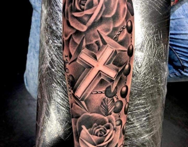 Cross and rose tattoo