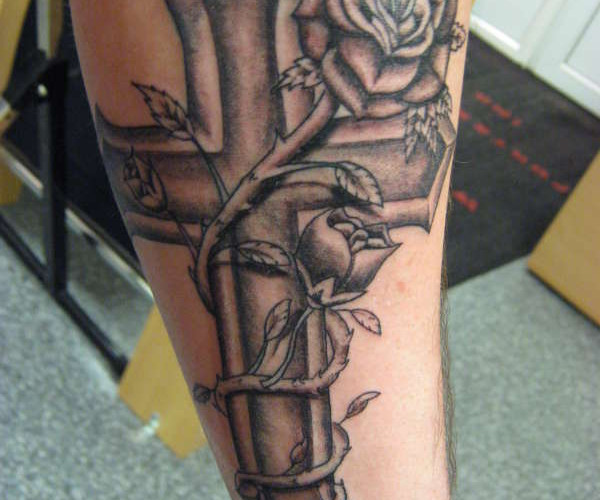 Cross and rose tattoo