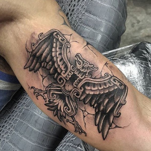 Image of an Aztec eagle tattoo on the biceps