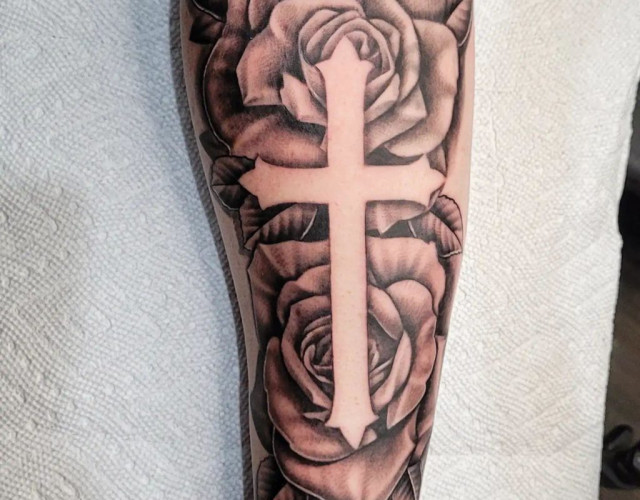 Cross and rose tattoo