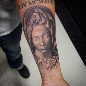 Catholic Mary Statue Tattoo on the forearm