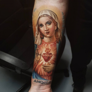 Colored Catholic Mary Tattoo on the forearm