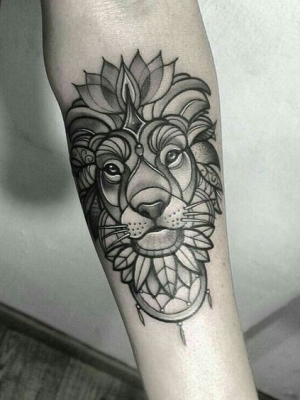 Lion mandala tattoo on the forearm