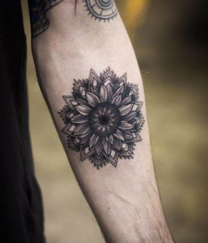 Black&White sunflower mandala tattoo on the forearm