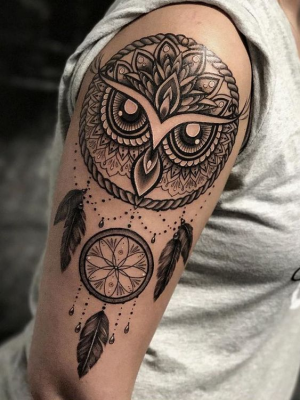 Owl mandala tattoo on the shoulder
