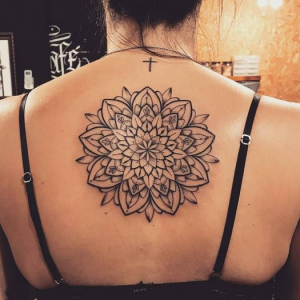 Circle mandala tattoo on the back