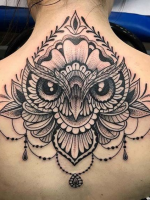 Owl mandala tattoo on the back