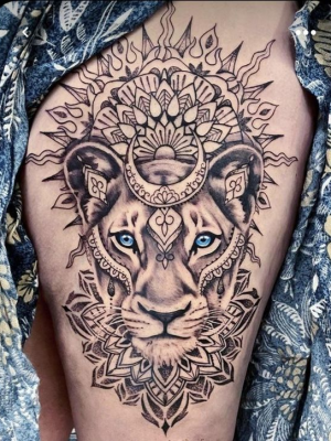 Lioness mandala tattoo on the thigh