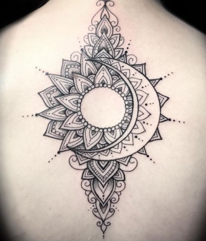 Sun and Moon tattoo on the back