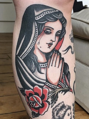 Traditional Catholic Mary tattoo on the leg