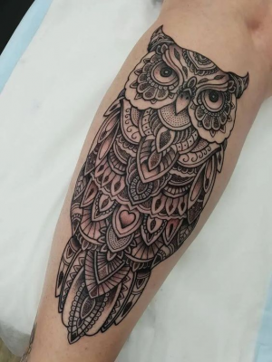 Owl mandala tattoo on the leg