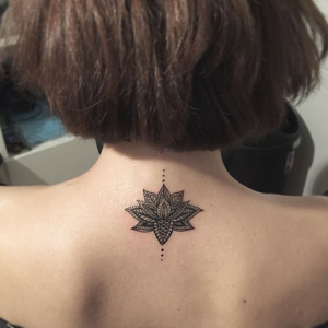 Lotus tattoo on the back of the neck